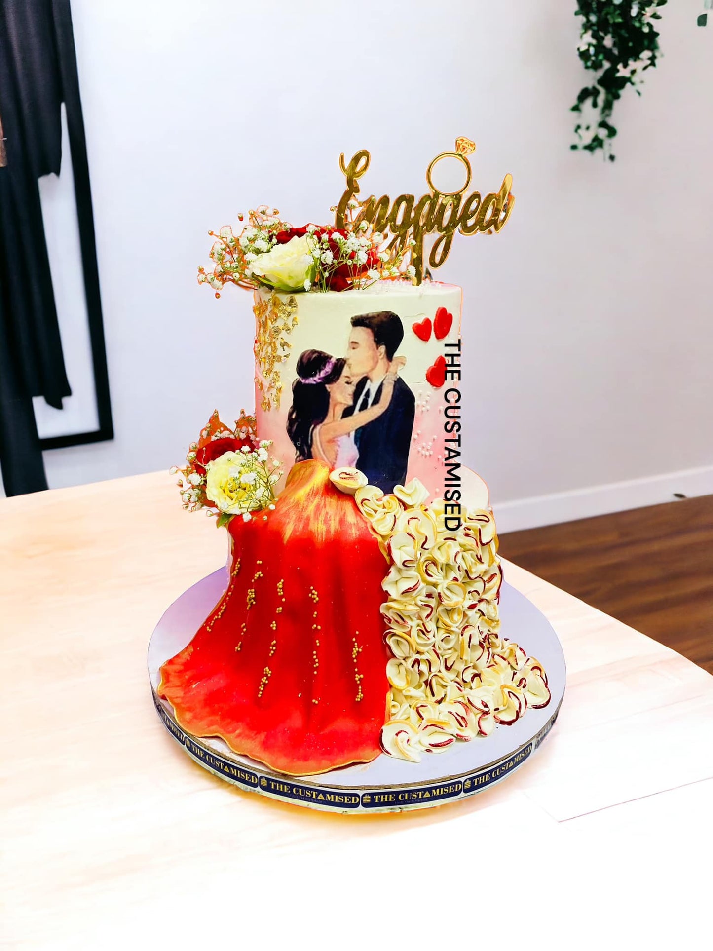 Dazzling Red & Gold Engagement Cake